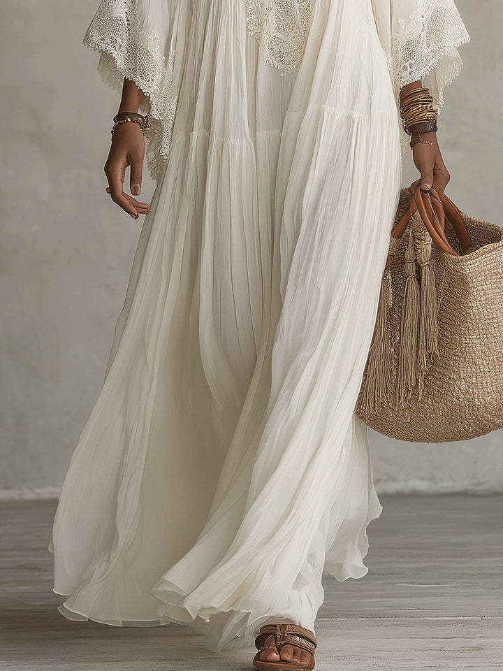 Adelaida | Robe longue en mousseline ivoire avec manches chauve-souris et dentelle blanche